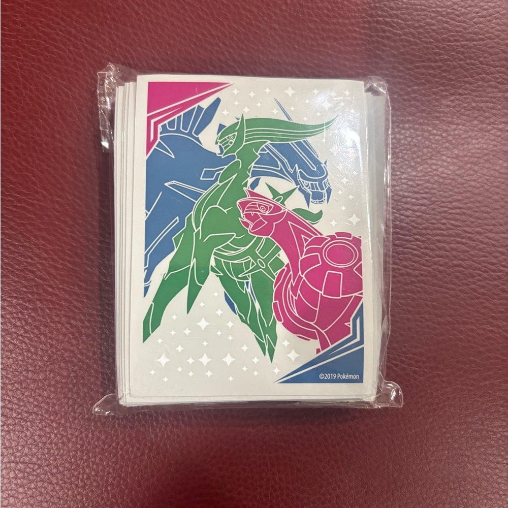 Pokemon Card Sleeves with Green, Blue, and Pink Design